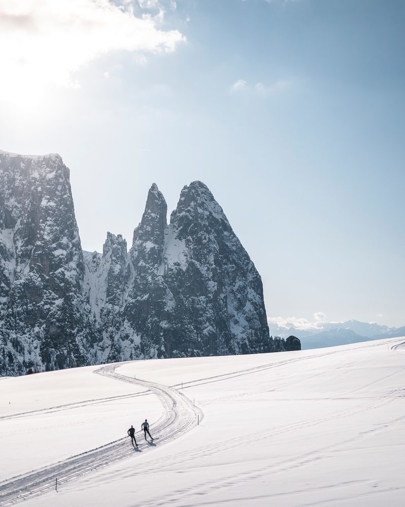 Cross-country skiing on the Seiser Alm with a view of the Schlern in South Tyrol.