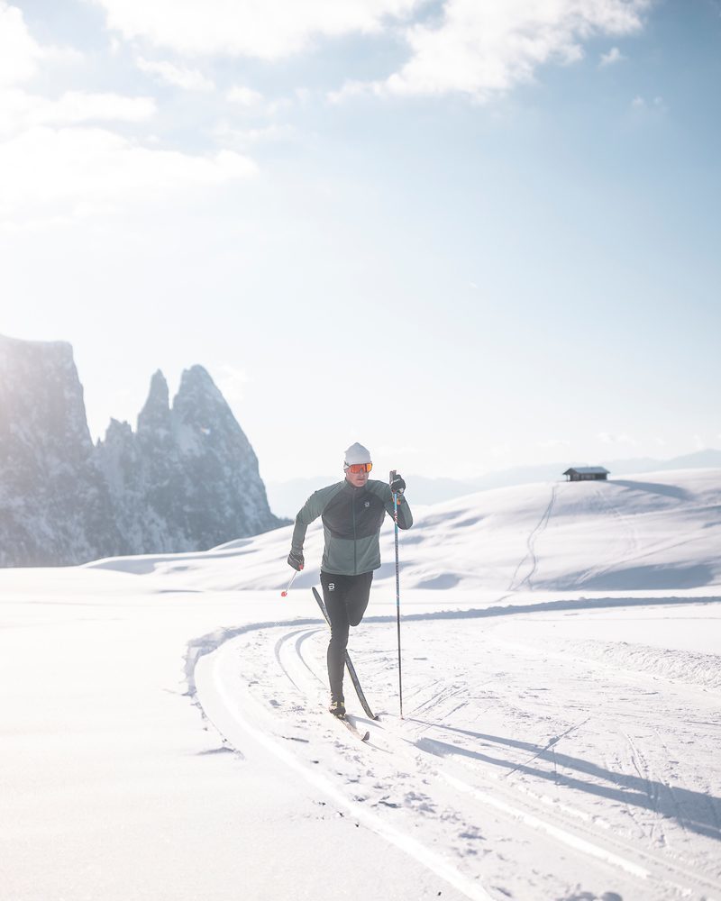 An athletic cross-country skier skating on a trail in the South Tyrolean Dolomites.